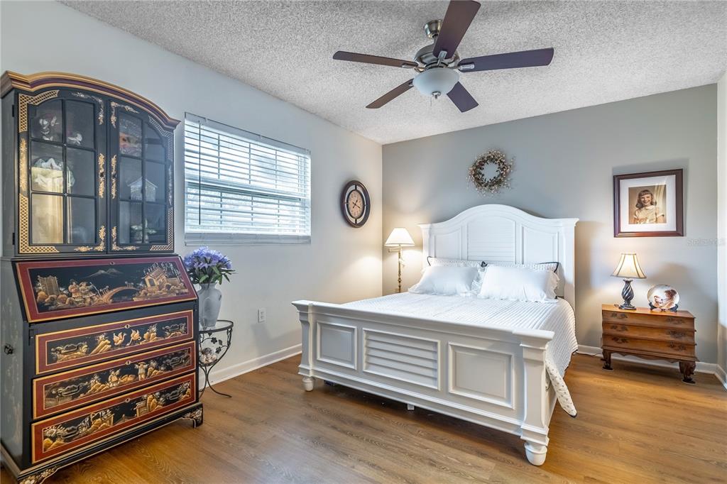 2500 Lee Road, Unit 243 Winter Park, FL 32789 - Photo 15 of 28 a bedroom with a bed and a chandelier