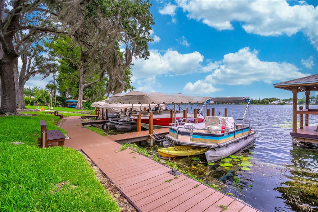 2500 Lee Road, Unit 243 Winter Park, FL 32789 - Photo 26 of 28 a view of a swimming pool with lawn chairs and a fire pit