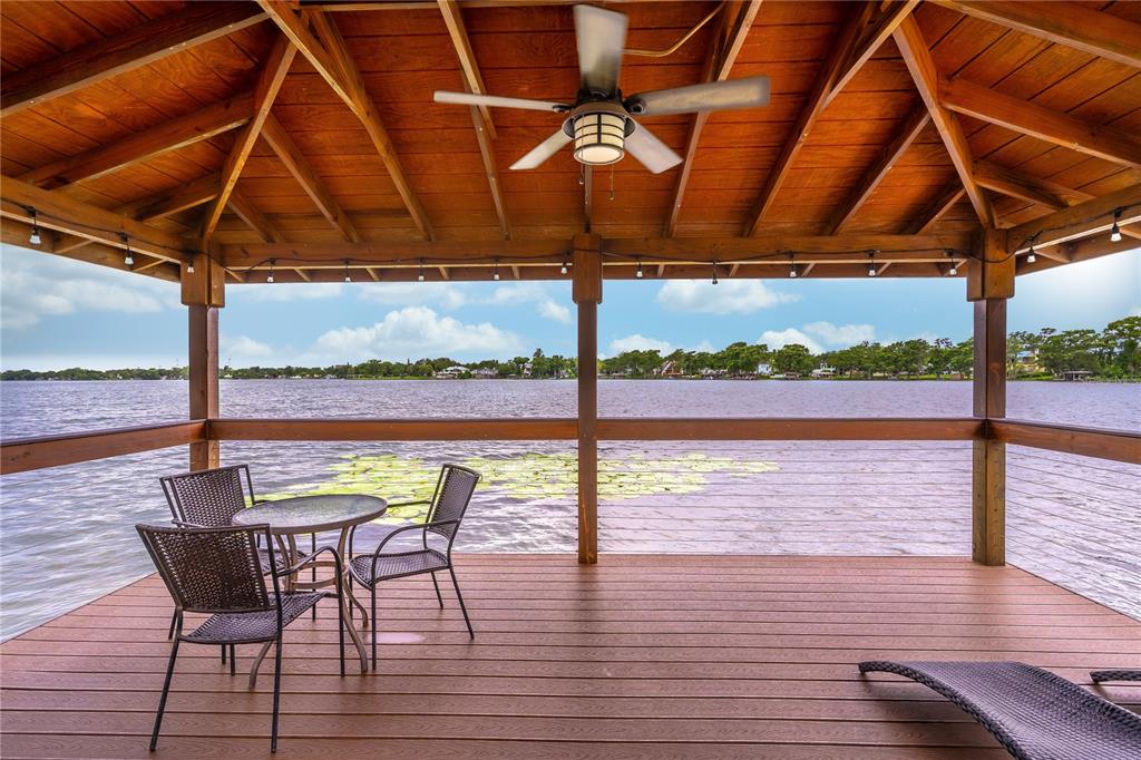 2500 Lee Road, Unit 243 Winter Park, FL 32789 - Photo 28 of 28 a view of a swimming pool with a table and chairs under an umbrella