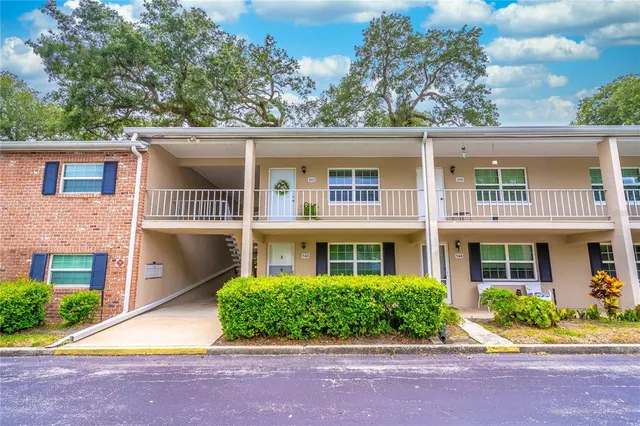 front view of a house next to a yard