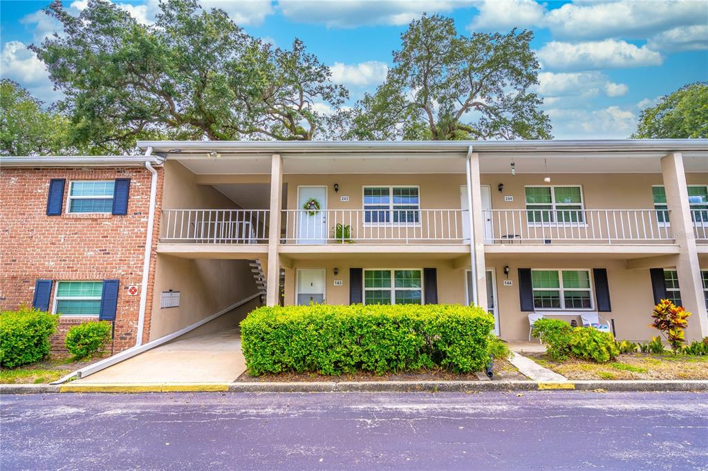 2500 Lee Road, Unit 243 Winter Park, FL 32789 - Photo 3 of 28 front view of a house next to a yard