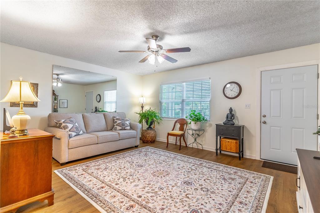 2500 Lee Road, Unit 243 Winter Park, FL 32789 - Photo 7 of 28 a living room with furniture rug and window