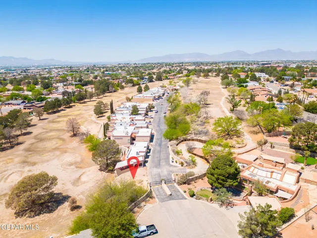 an aerial view of residential houses with outdoor space