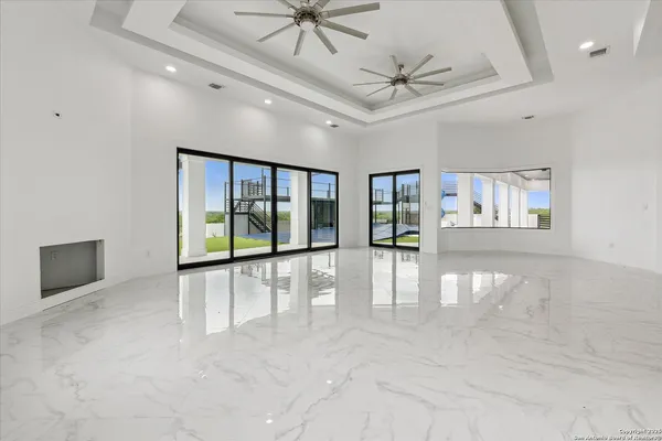 a spacious bathroom with double sink and a mirror