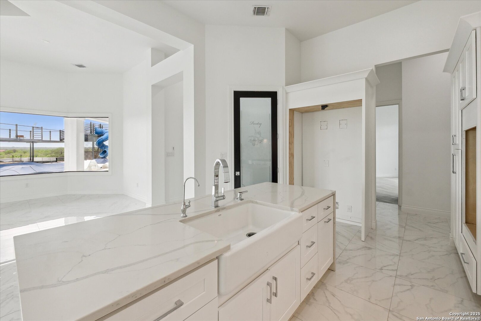 1799 County Road 651 Devine, TX 78016 - Photo 18 of 72 a spacious bathroom with double sink and a mirror