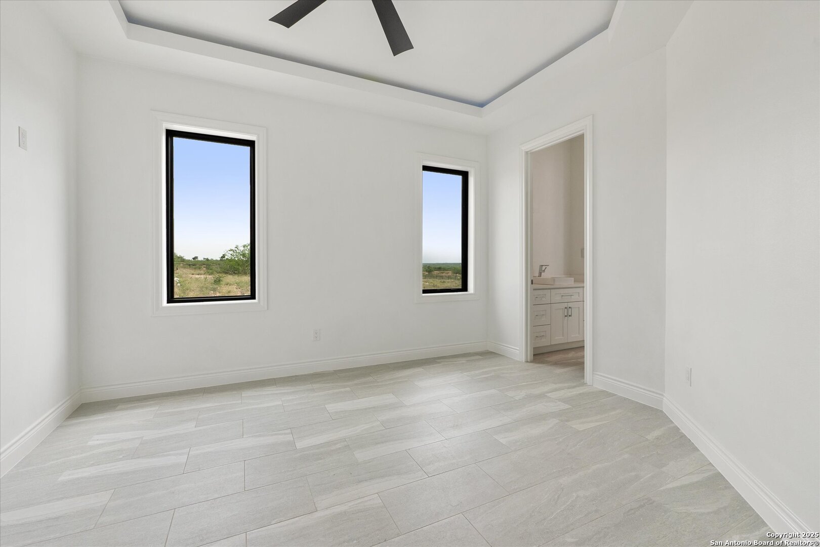 1799 County Road 651 Devine, TX 78016 - Photo 25 of 72 an empty room with windows and closet
