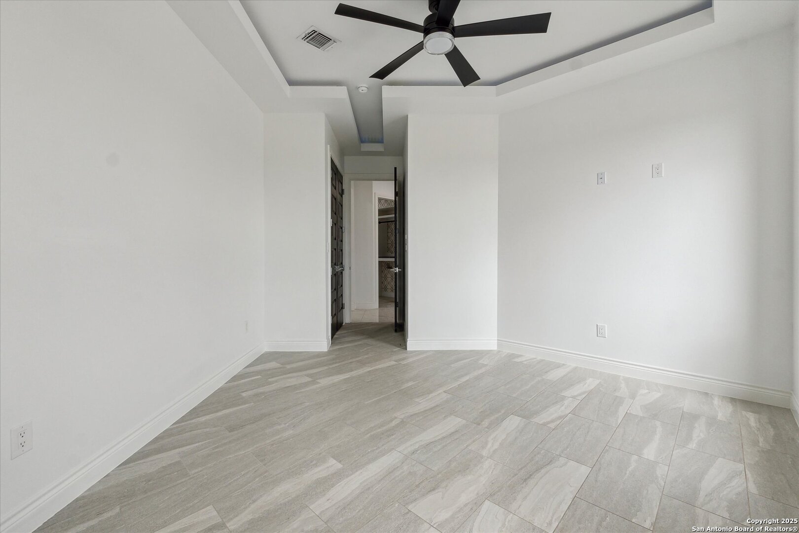 1799 County Road 651 Devine, TX 78016 - Photo 26 of 72 a view of a room with a ceiling fan and a white walls