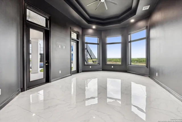 a view of a field with an ocean view