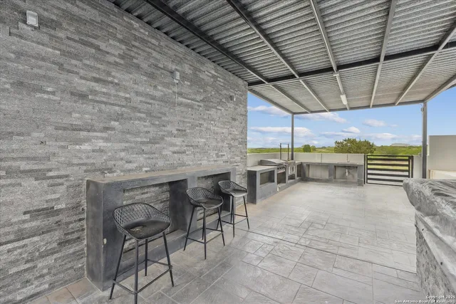 a view of a house with backyard and a ocean view