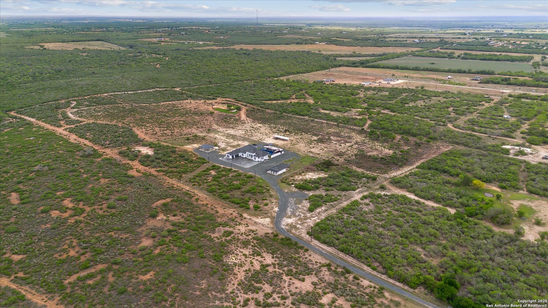 1799 County Road 651 Devine, TX 78016 - Photo 43 of 72 a view of a field with an ocean view