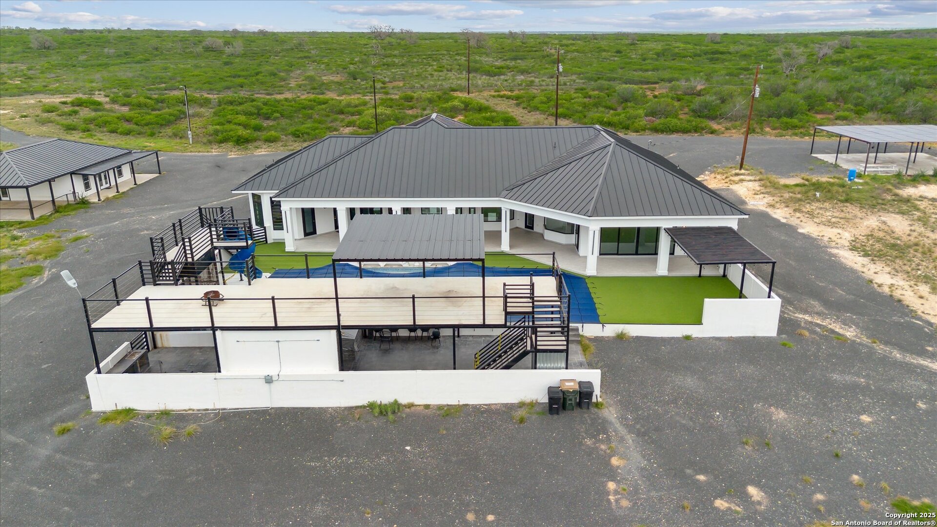 1799 County Road 651 Devine, TX 78016 - Photo 57 of 72 a house view with a garden space