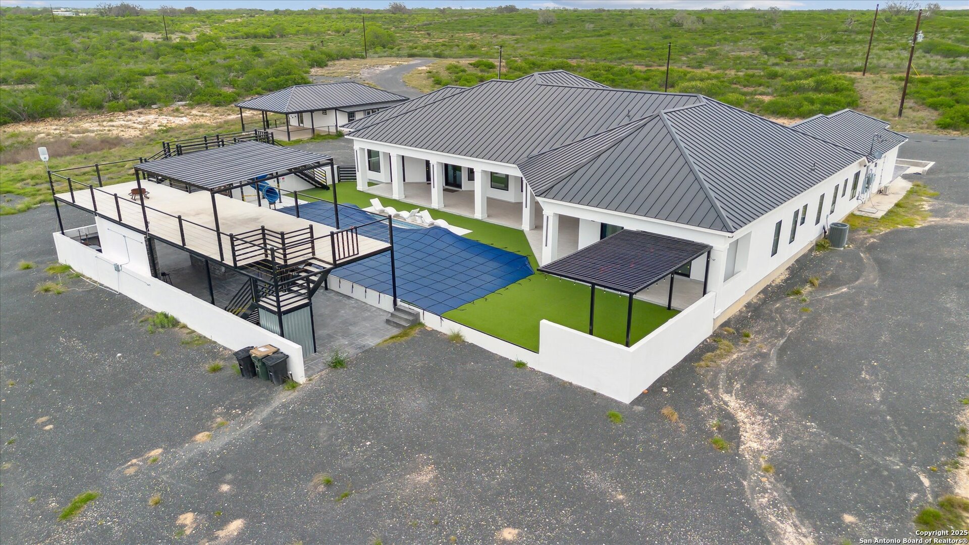 1799 County Road 651 Devine, TX 78016 - Photo 58 of 72 an aerial view of a house