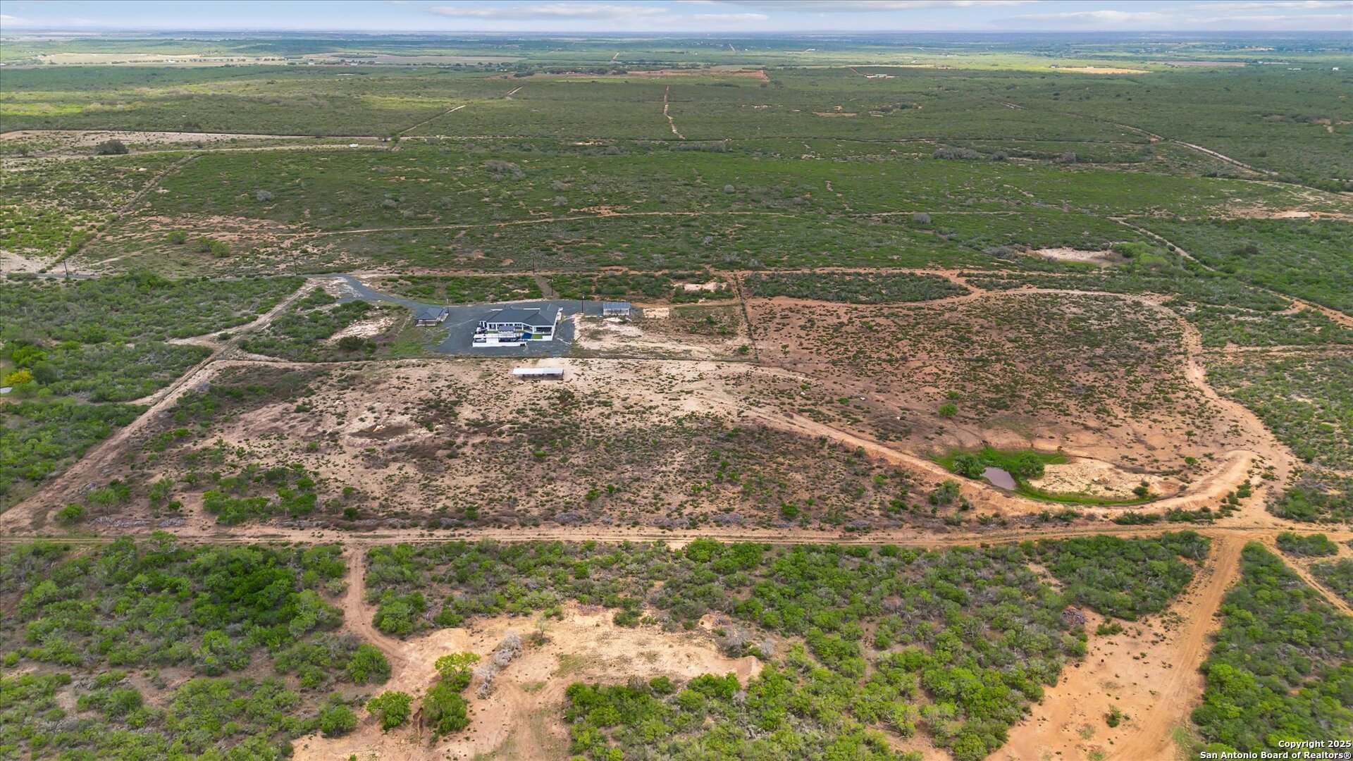1799 County Road 651 Devine, TX 78016 - Photo 66 of 72 a view of a field with an ocean
