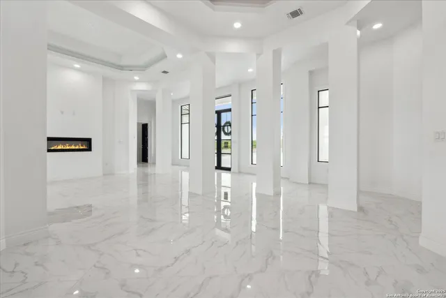 a view of a hallway with a chandelier