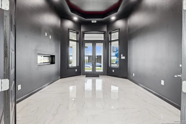 a kitchen with kitchen island sink white cabinets and refrigerator