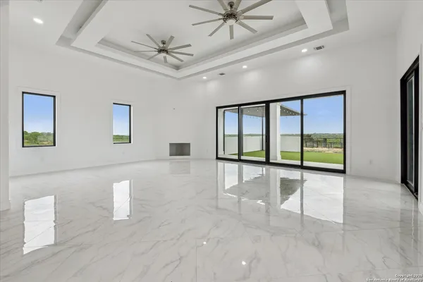 a kitchen with a sink and a large window