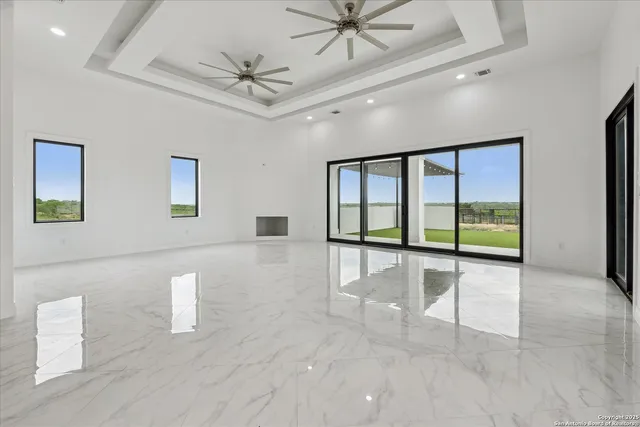 a kitchen with a sink and a large window