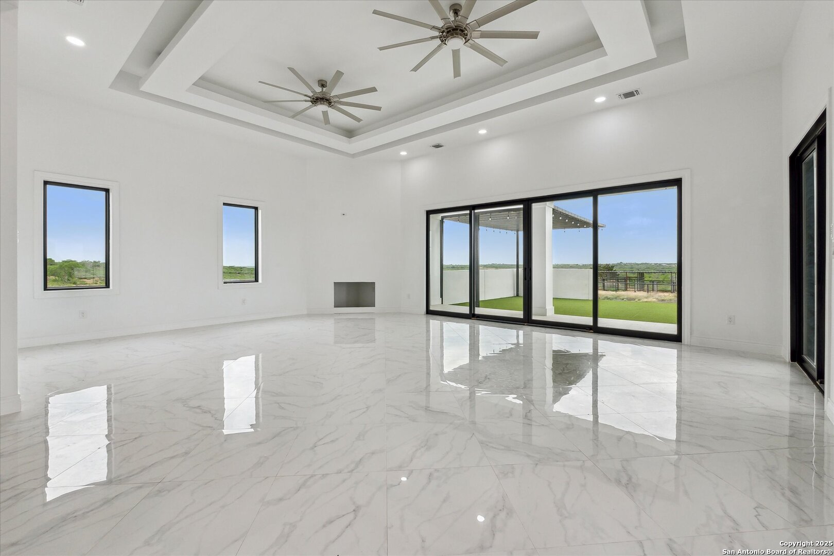1799 County Road 651 Devine, TX 78016 - Photo 10 of 72 a view of an empty room with a window
