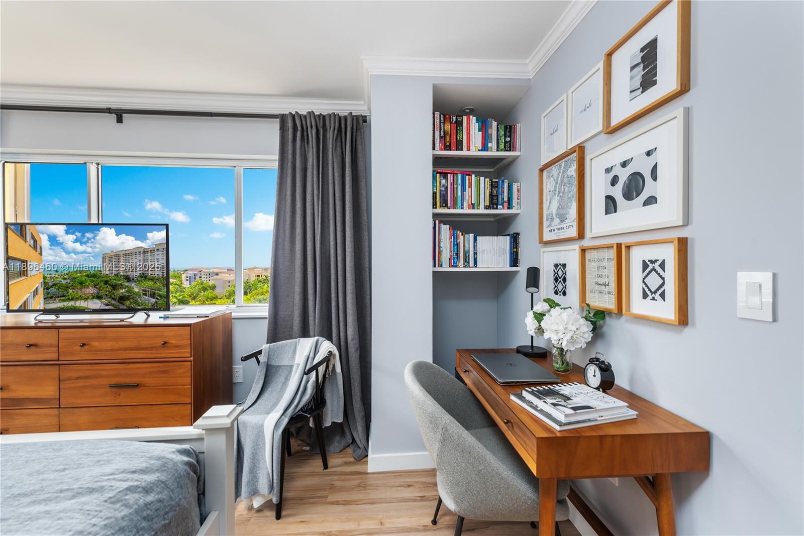 650 Ocean Drive, Unit 10E Key Biscayne, FL 33149 - Photo 16 of 20 a workspace with furniture and a book shelf