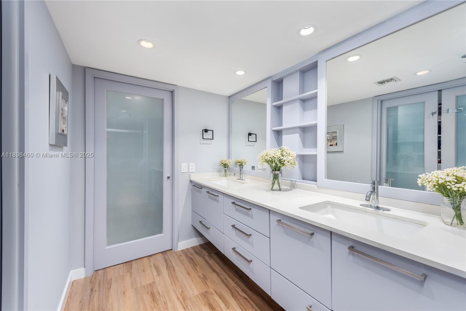 650 Ocean Drive, Unit 10E Key Biscayne, FL 33149 - Photo 17 of 20 a spacious bathroom with a double vanity sink mirror and shower