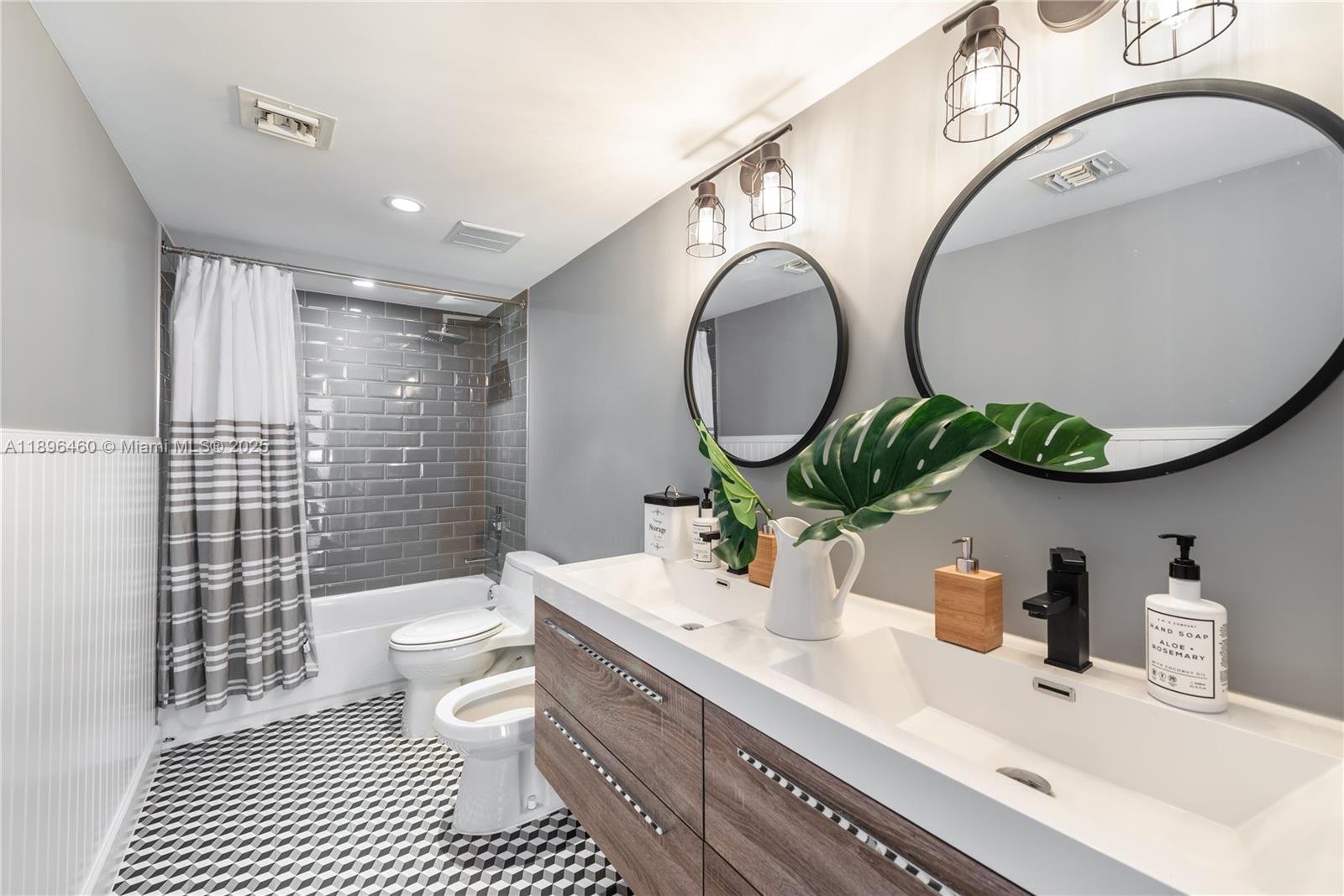 650 Ocean Drive, Unit 10E Key Biscayne, FL 33149 - Photo 20 of 20 a bathroom with a sink mirror vanity and toilet