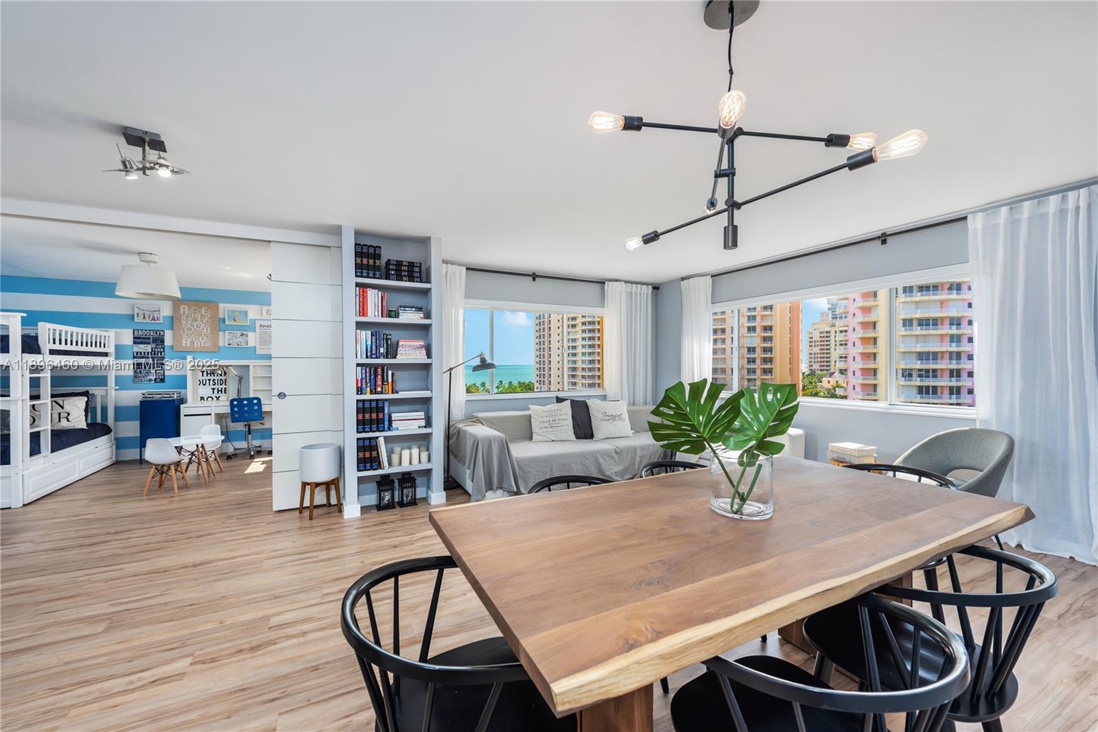 650 Ocean Drive, Unit 10E Key Biscayne, FL 33149 - Photo 5 of 20 a view of a dining room with furniture and wooden floor
