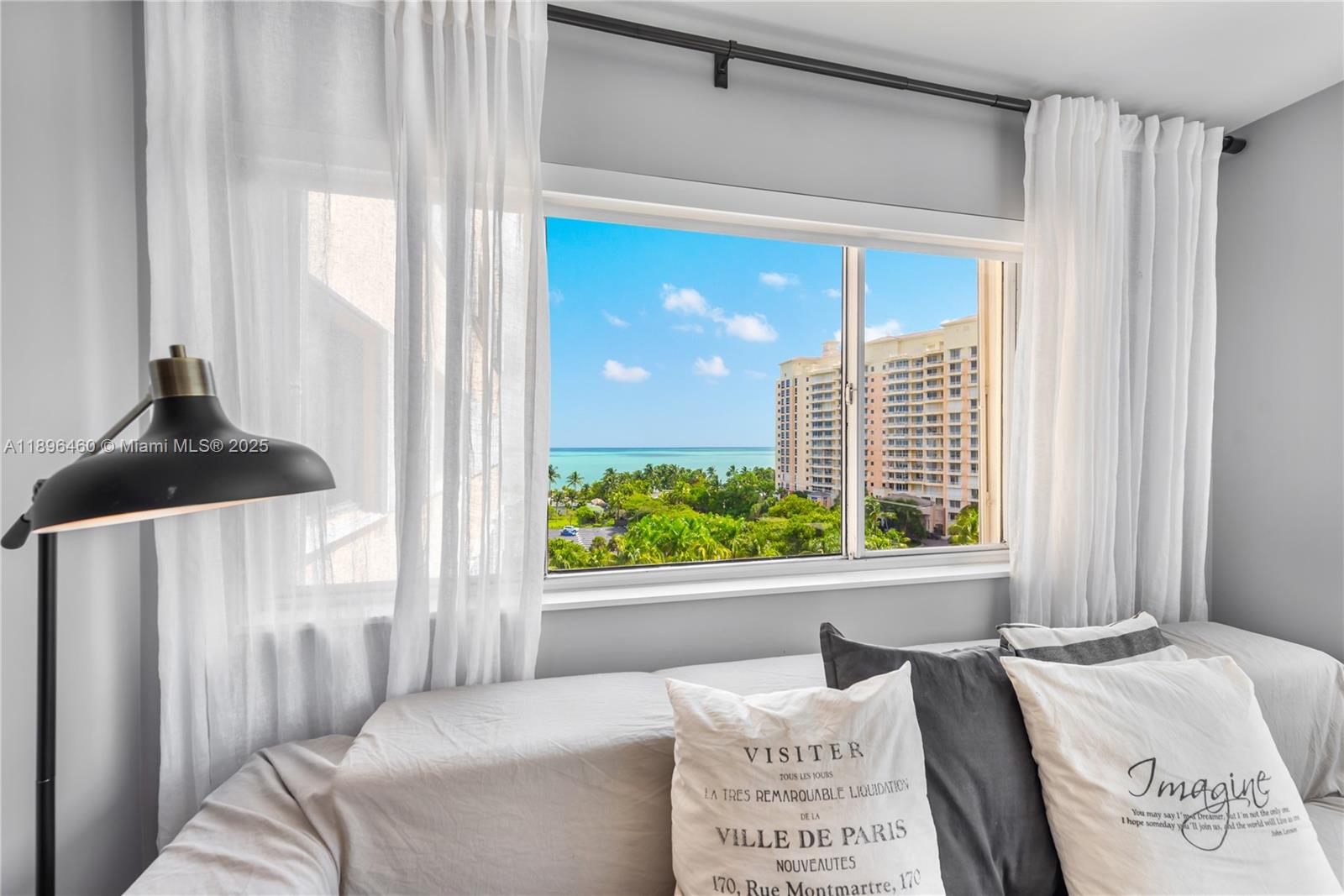 650 Ocean Drive, Unit 10E Key Biscayne, FL 33149 - Photo 7 of 20 a bedroom with a bed and a window