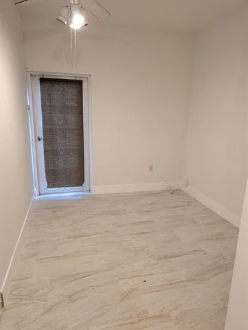 a view of walk in closet with clothes