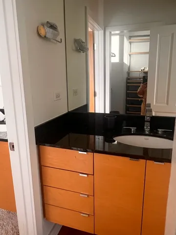 a kitchen with a refrigerator and a sink