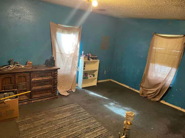 a room with gym equipment and a window