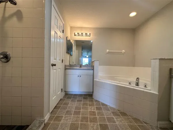 a bathroom with a bathtub and a sink