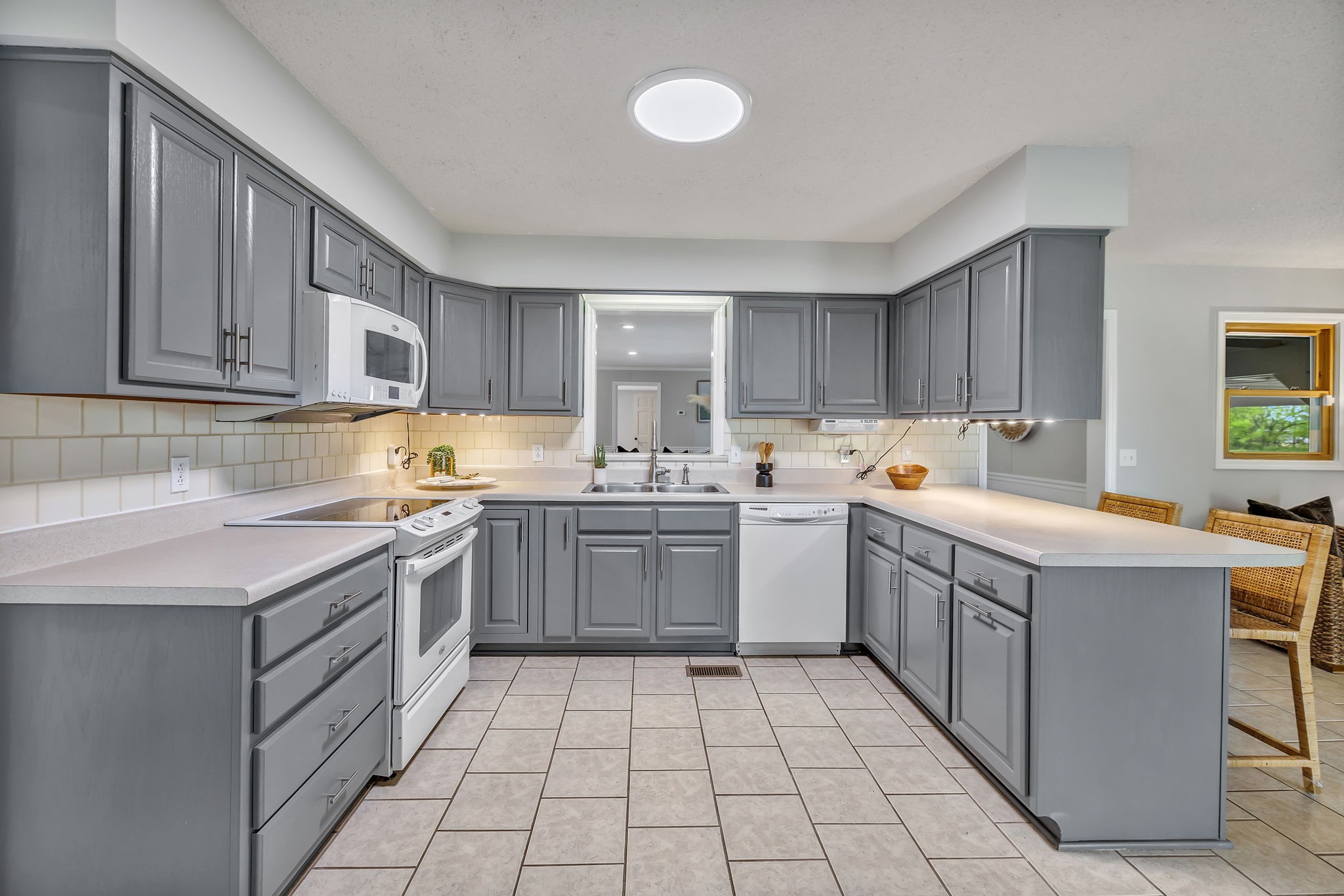 7068 Miller Road Christiana, TN 37037 - Photo 16 of 52 a kitchen with a sink window and cabinets