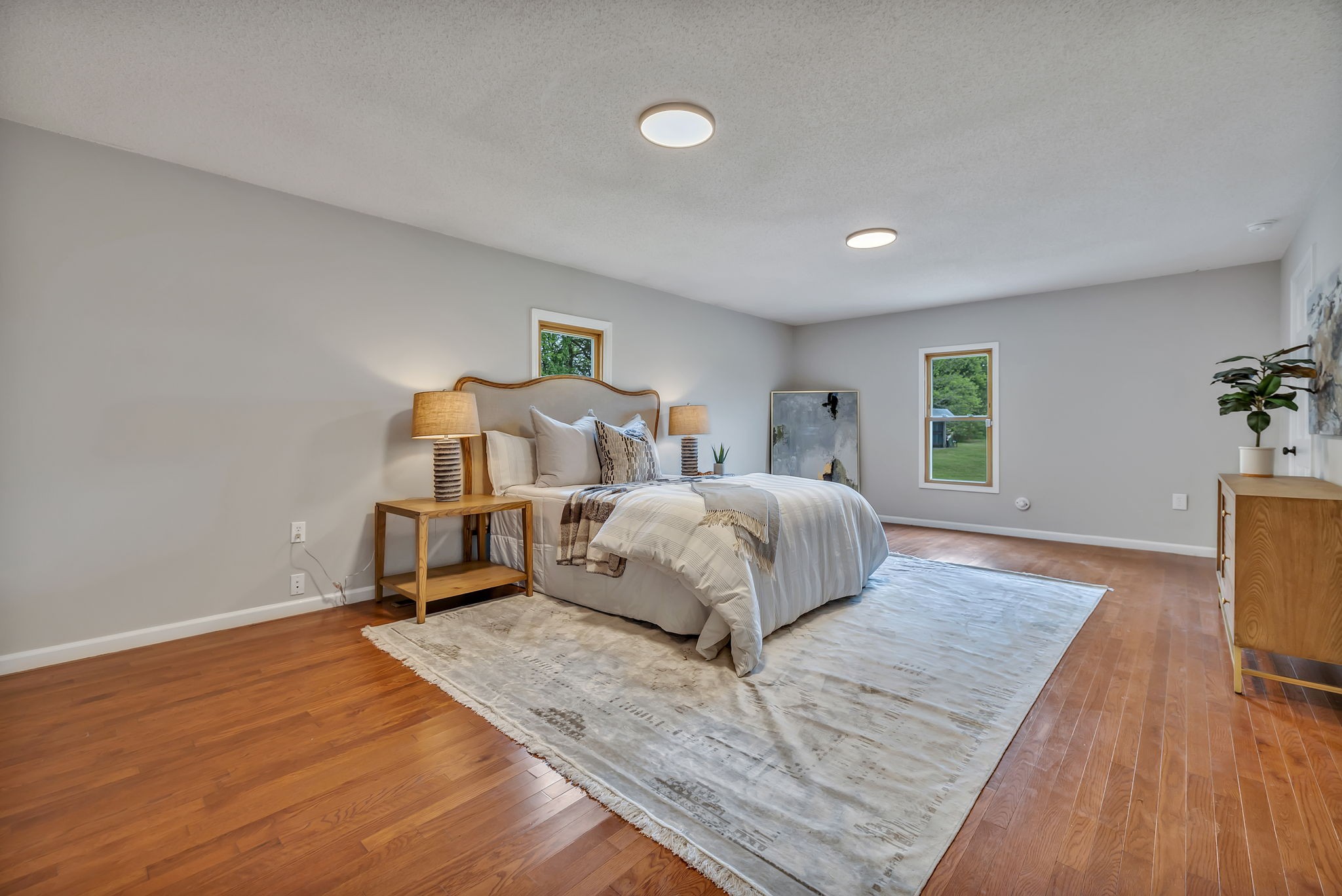 7068 Miller Road Christiana, TN 37037 - Photo 21 of 52 a bedroom with a bed and wooden floor