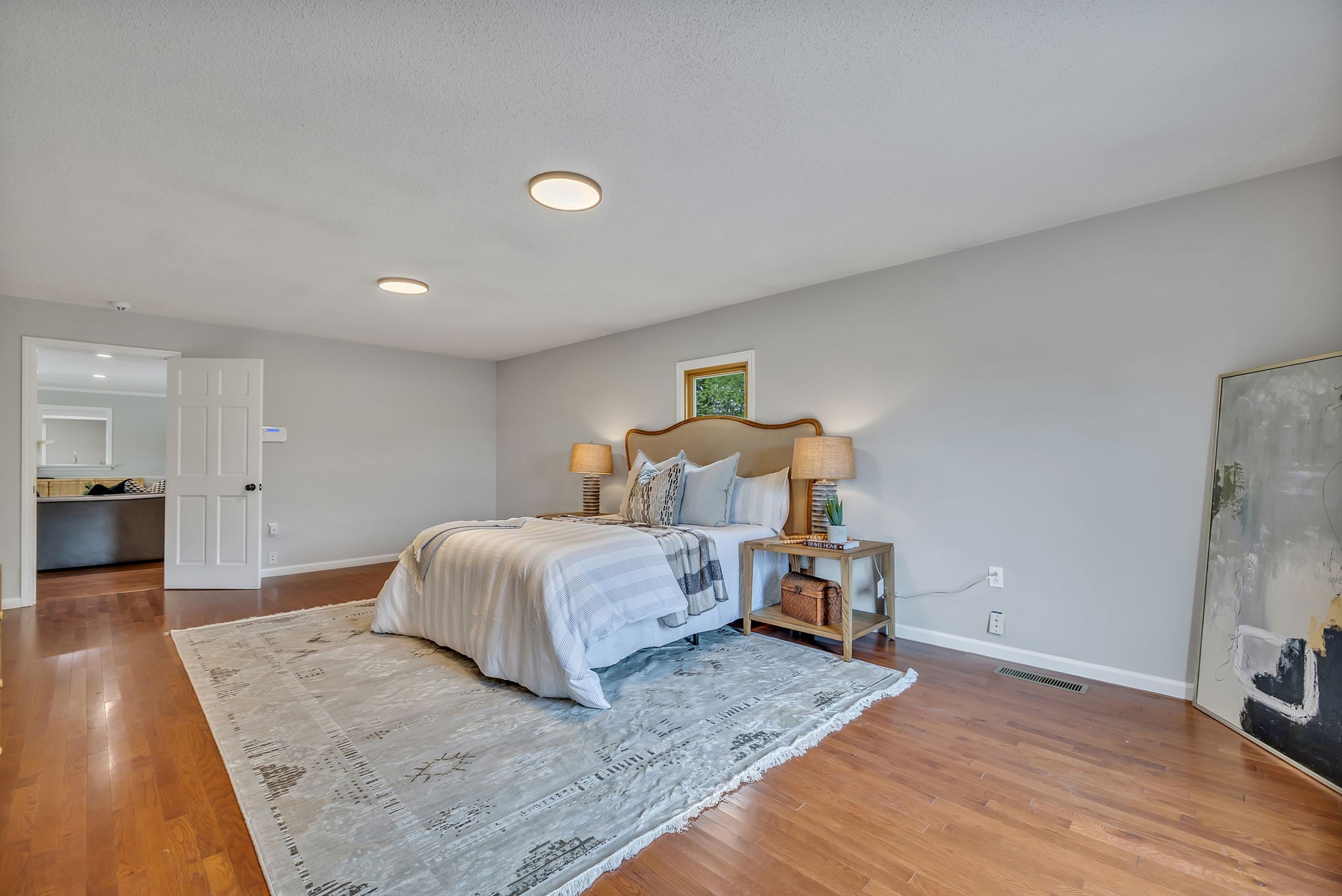 7068 Miller Road Christiana, TN 37037 - Photo 22 of 52 a spacious bedroom with a bed and wooden floor