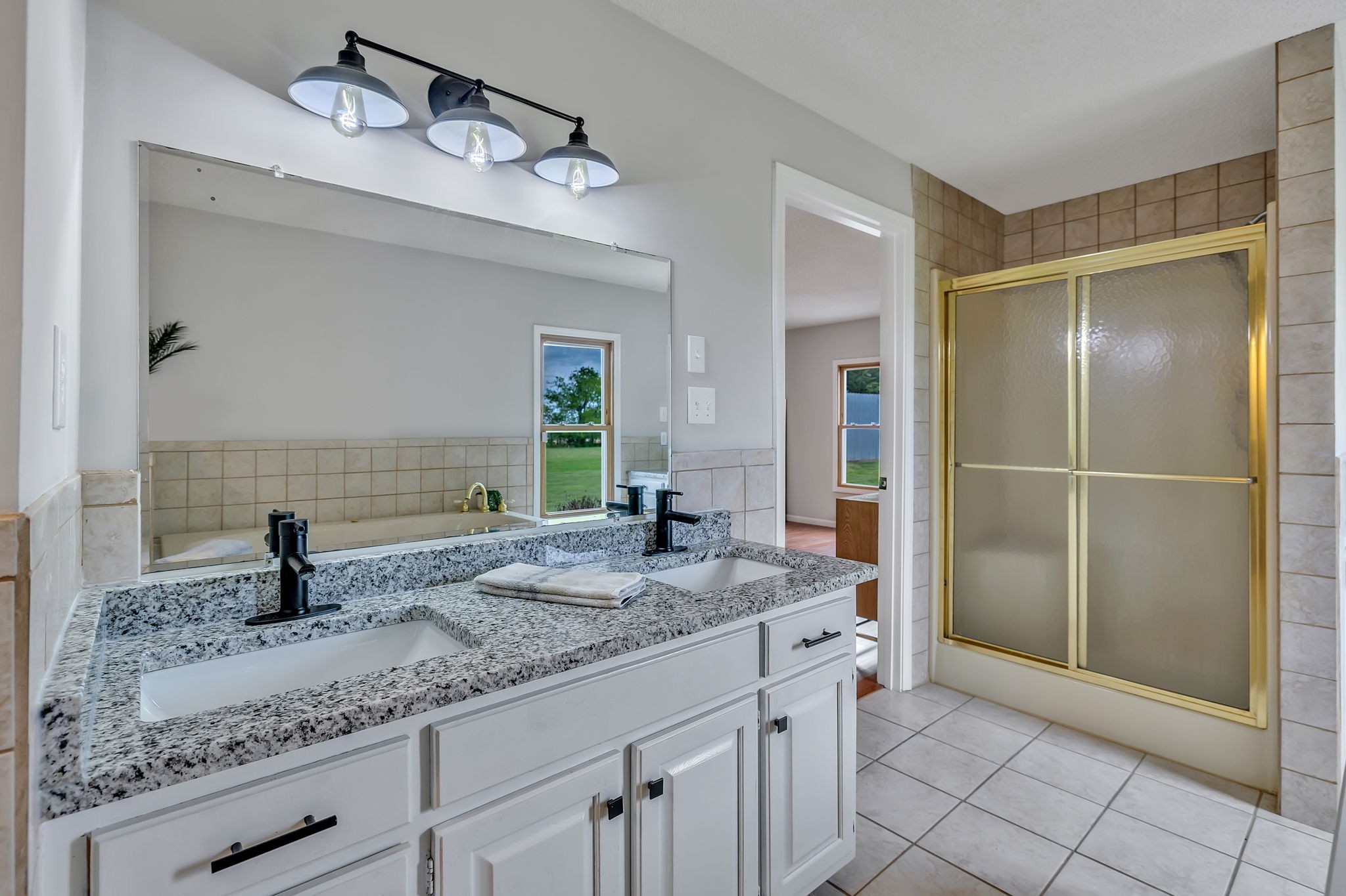 7068 Miller Road Christiana, TN 37037 - Photo 27 of 52 a bathroom with a granite countertop sink and a mirror