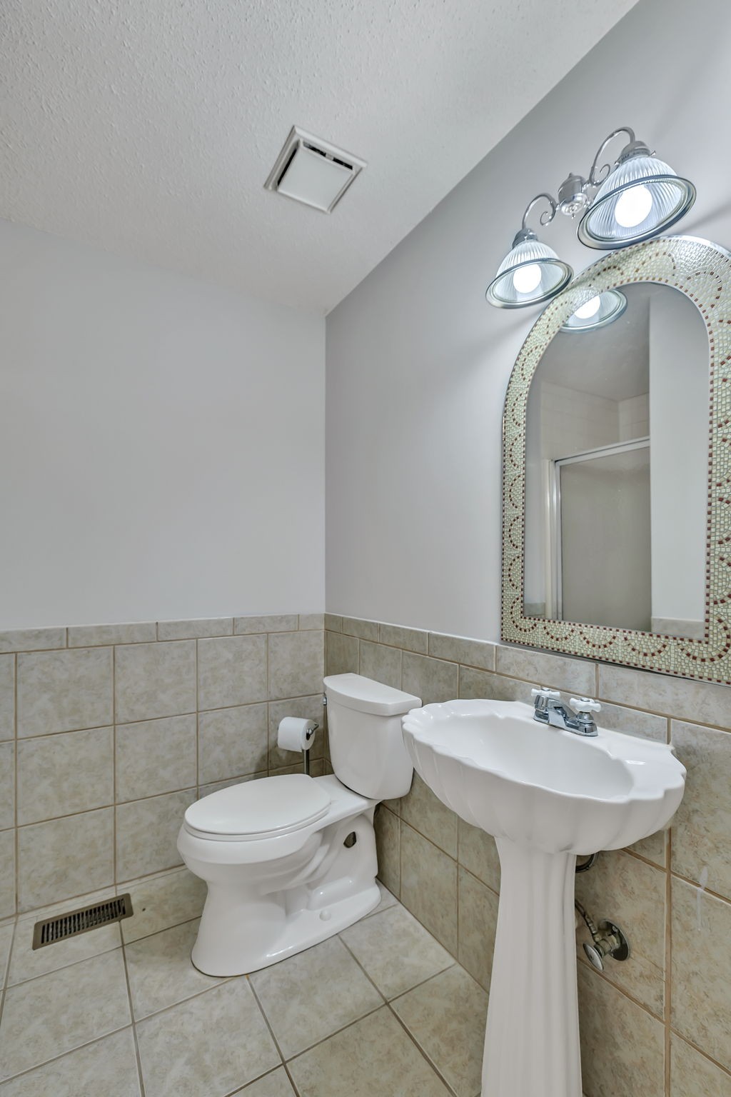 7068 Miller Road Christiana, TN 37037 - Photo 30 of 52 a bathroom with a toilet sink and mirror