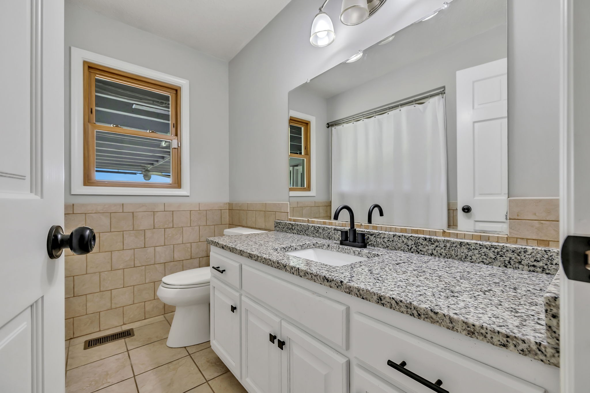 7068 Miller Road Christiana, TN 37037 - Photo 32 of 52 a bathroom with a granite countertop sink and a toilet