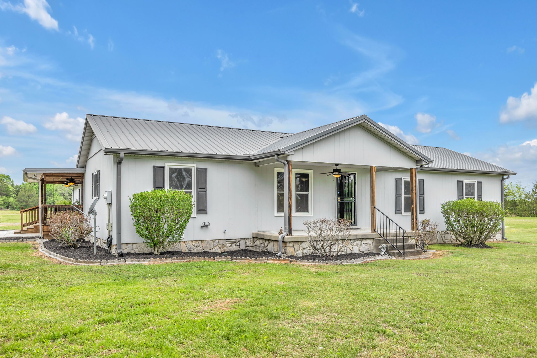 7068 Miller Road Christiana, TN 37037 - Photo 4 of 52 a front view of a house with garden