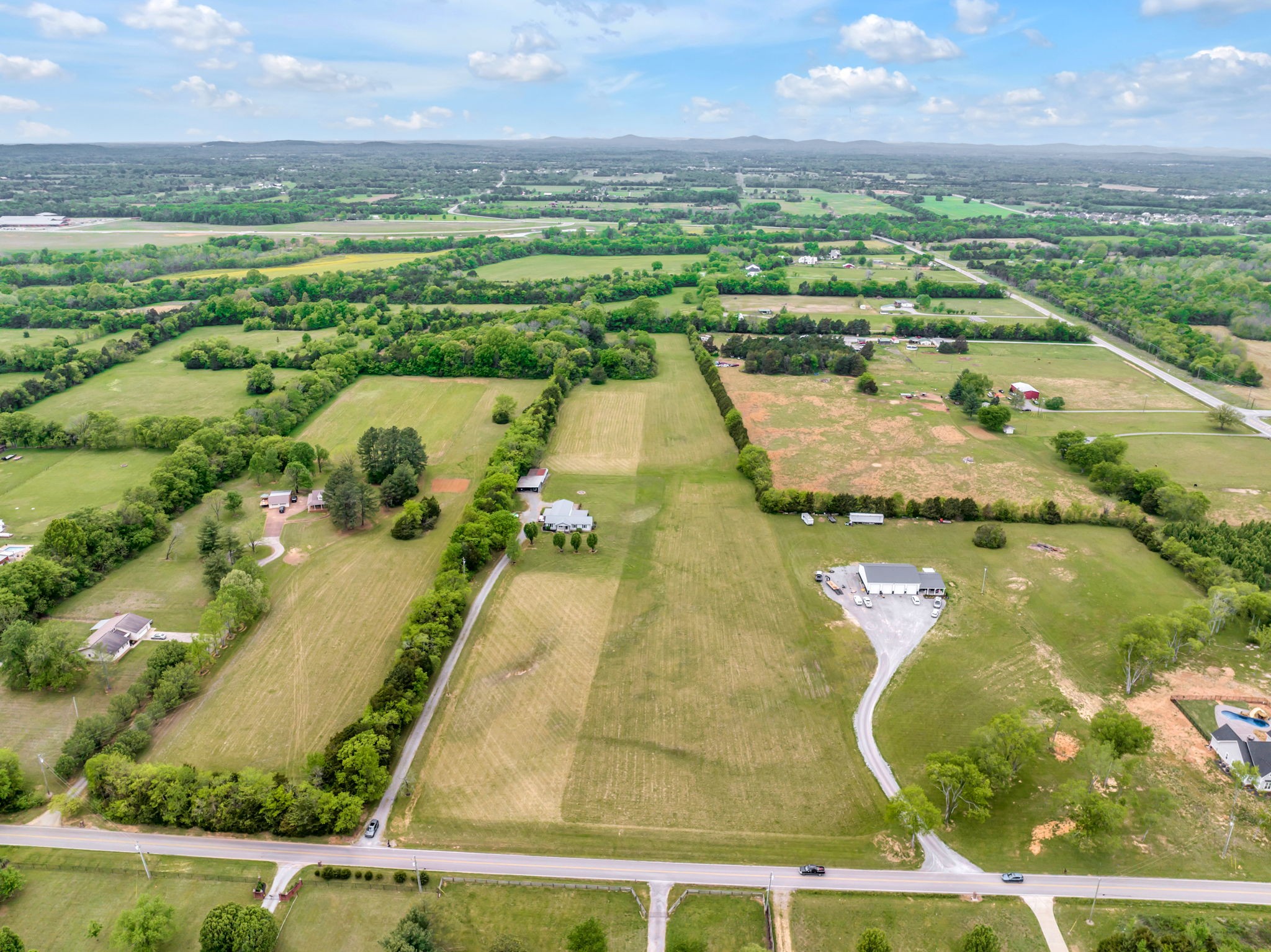 7068 Miller Road Christiana, TN 37037 - Photo 43 of 52 an aerial view of residential houses with outdoor space and swimming pool