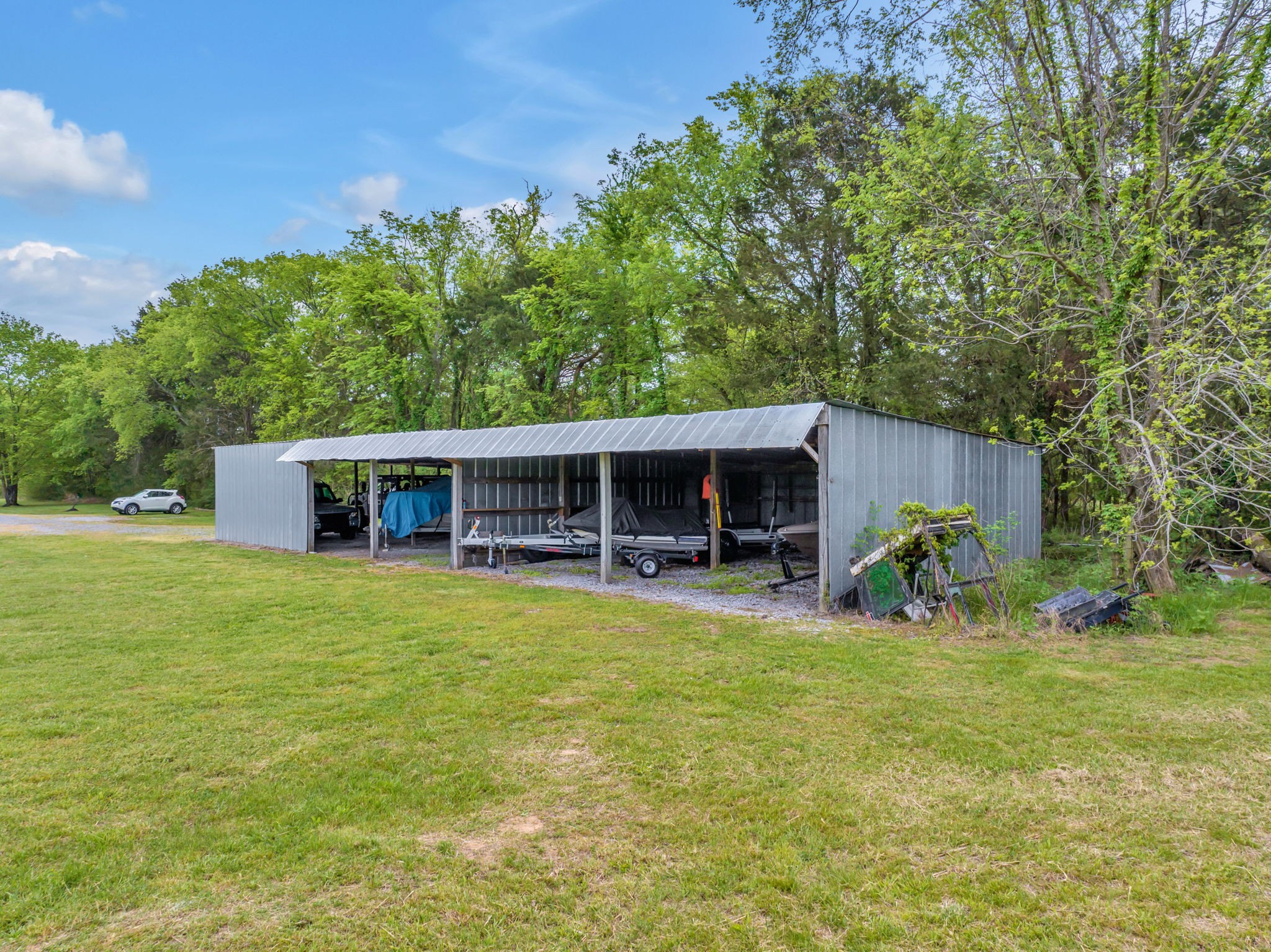 7068 Miller Road Christiana, TN 37037 - Photo 48 of 52 a view of a house with a yard and sitting area