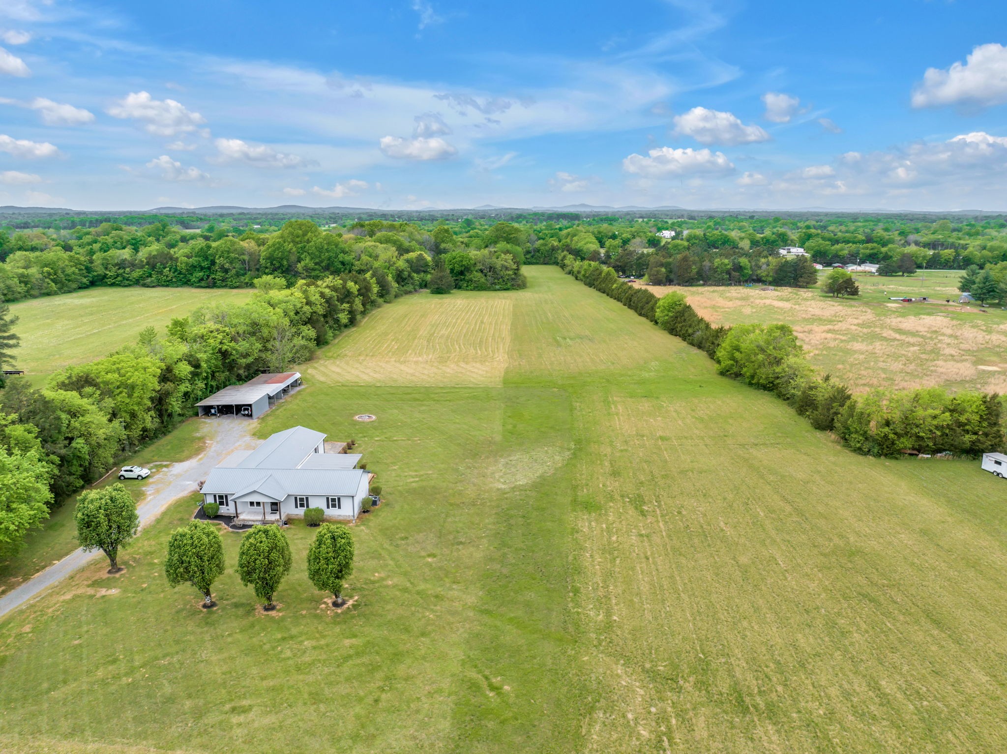 7068 Miller Road Christiana, TN 37037 - Photo 50 of 52 a view of a lake with a yard