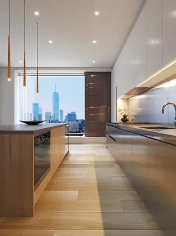 a kitchen with a sink a cabinets and appliances