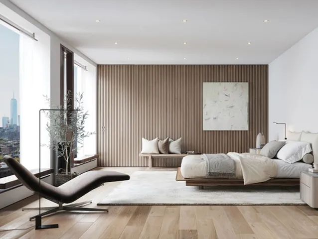 a bedroom with furniture and a large window