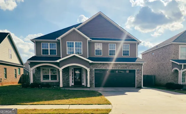 a front view of a house with a yard