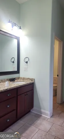 a bathroom with a bathtub and window