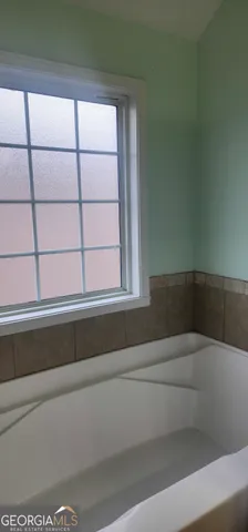 a bathroom with a glass shower door
