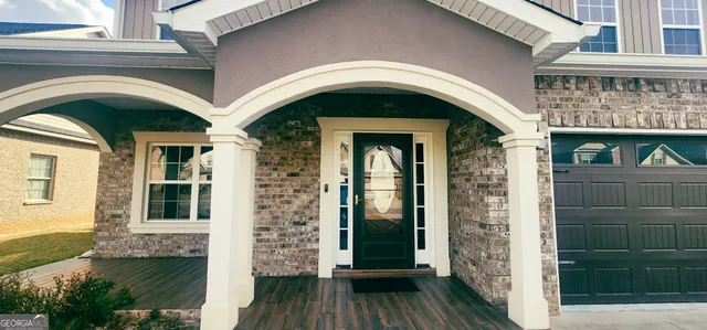 a front view of a house with a glass door