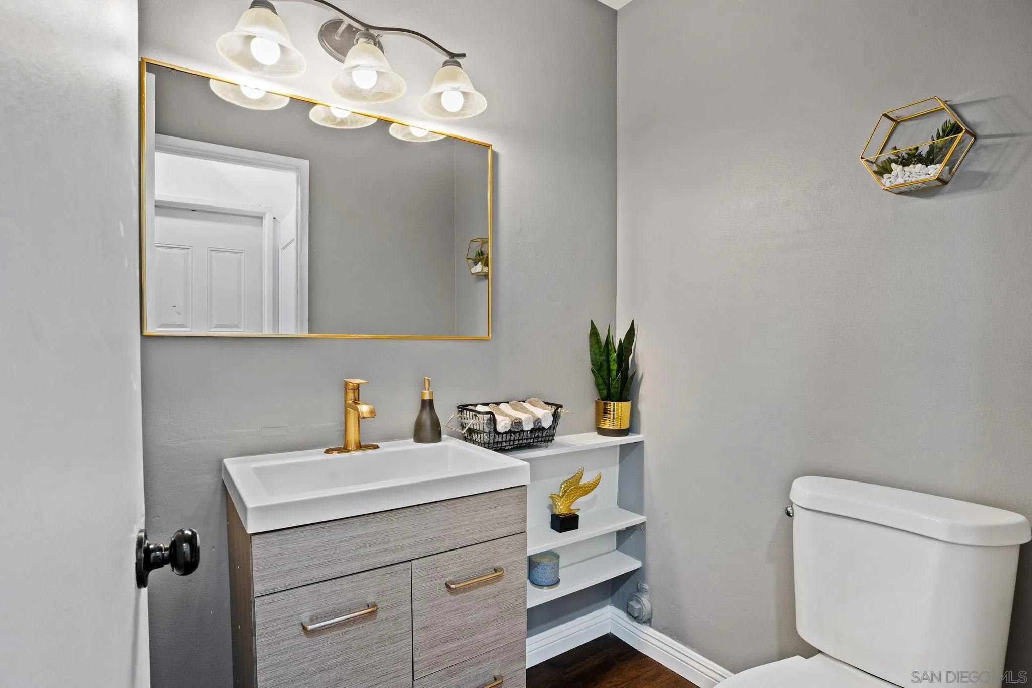 2012 Terracina Circle Spring Valley, CA 91977 - Photo 15 of 34 a bathroom with a sink a vanity and a mirror