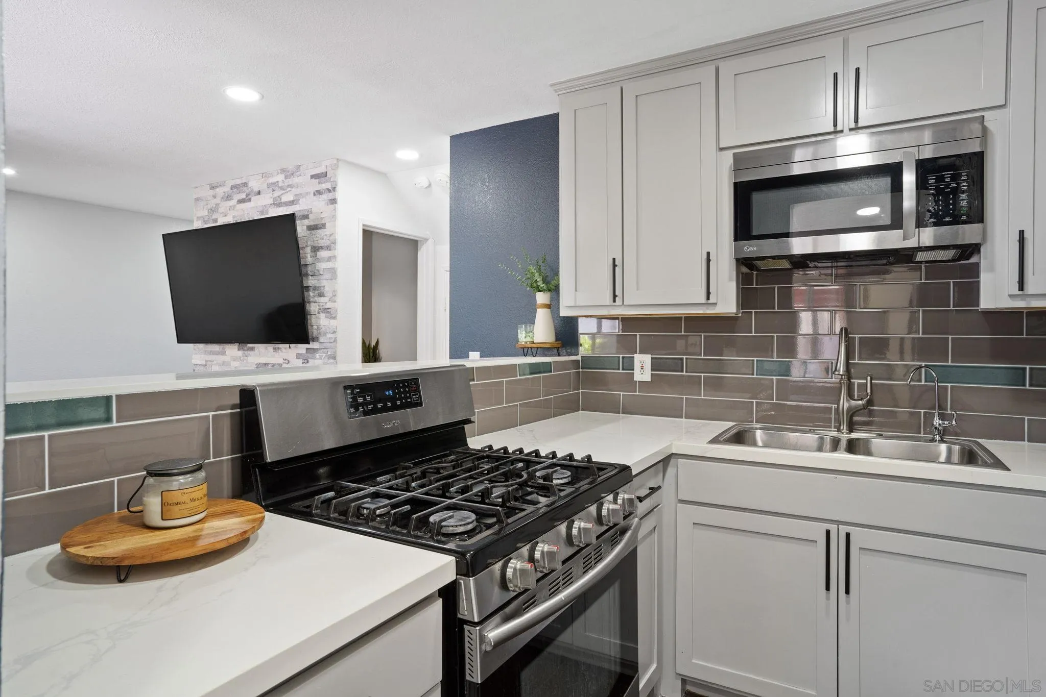2012 Terracina Circle Spring Valley, CA 91977 - Photo 8 of 34 a kitchen with a sink stove and microwave