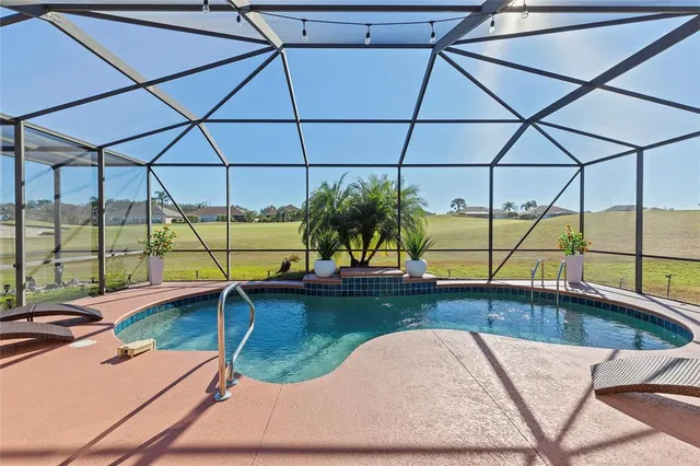 a swimming pool with view of lake view and mountain view